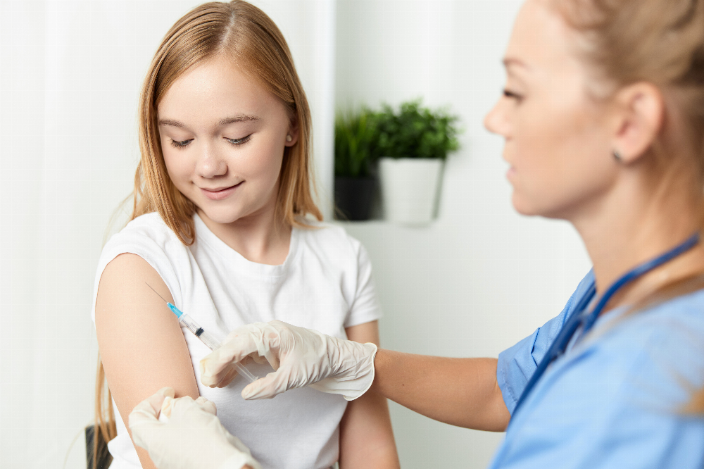 Patient getting a vaccine by nurse